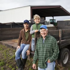 Farmers-and-young-boy-around-the-back-of-a-truck